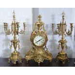 Cast brass three piece clock garniture,