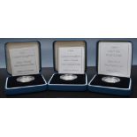 Coins:  Silver proof, one pound and two