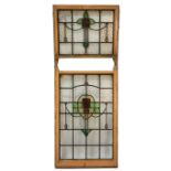 Two pairs of Arts and Crafts stained glass sash windows, leaded panels with stylised roses and