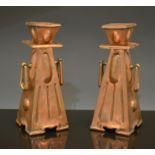 A pair of Arts and Crafts copper candle