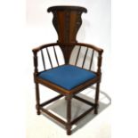 A walnut corner armchair, circa 1888, by