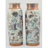 Pair of Chinese polychrome vases, with figures and dragons, height 45cm, (repaired).