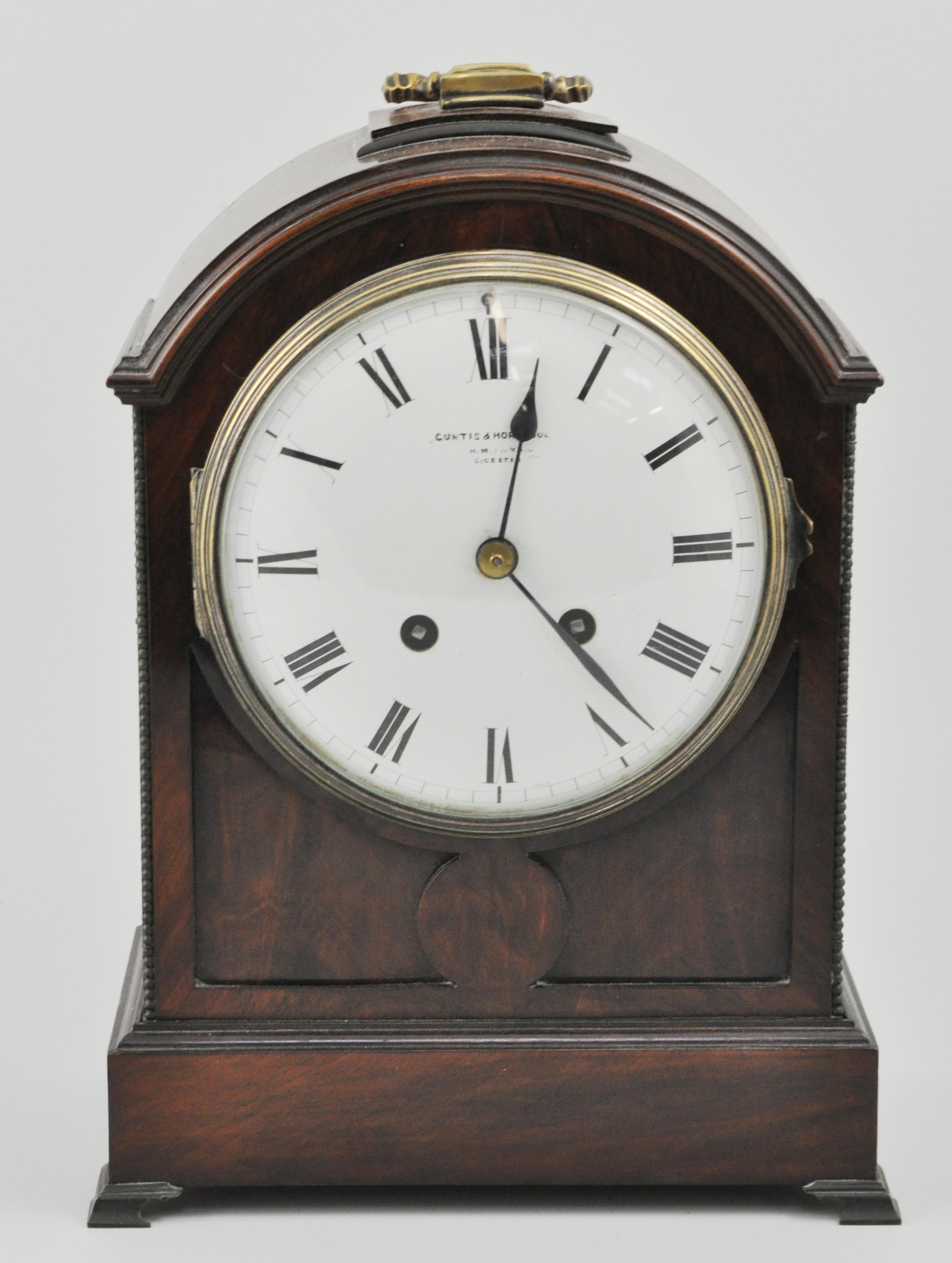 Mahogany cased bracket clock, with a French movement, dial signed Curtis and Holland,