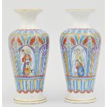 Small pair of pottery vases, decorated with religious scenes, height 15cm.