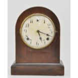Mahogany cased domed top mantel clock, on a plinth base, height 29cm.