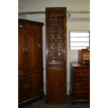 Four Chinese stained wood screen panels, fretted divisions with scrolls around a key pattern