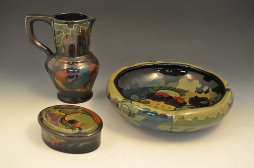 Three pieces of high-fired Gouda pottery, circa 1915, including bowl with inverted rim, oval pin