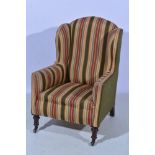 Tradition easy chair, re-upholstered in striped cotton, turned and ringed walnut legs, width 72cm.
