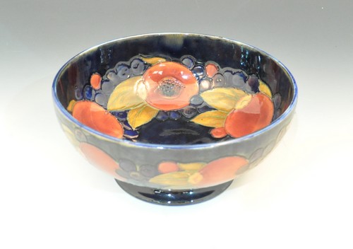 Moorcroft footed bowl, Pomegranate design on a blue ground, signature mark, diameter 21cm.