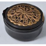 Turned horn circular snuff box, wrythen moulded with gilt highlights, diameter 7cm, restored.