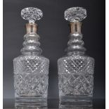 Pair of lead crystal decanters, with hallmarked silver collars, with stoppers, 29cm.