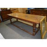 Oak refectory table, 20th Century, Adzed top, carved frieze, turned legs, low stretchers, 243cm x