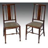 Pair of Edwardian stained wood bedroom chairs, inlaid splats, upholstered seats.