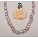 Pearl necklace, with a silver mounted blue topaz and ivory floral drop.