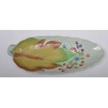 Clarice Cliff, Celtic Harvest pattern, 24cm, a Clarice Cliff leaf shape dish and a Beswick jug, A