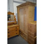 Striped pine wardrobe, panel door (lacking mirror), single drawer under, width 110cm, height 193cm.