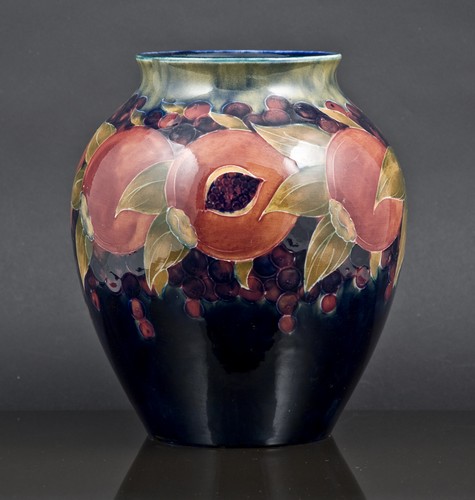 Moorcroft ovoid vase, Pomegranate design, on a green-to-blue ground, signature mark, 21cm.