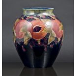 Moorcroft ovoid vase, Pomegranate design, on a green-to-blue ground, signature mark, 21cm.