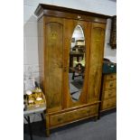 Walnut two piece bedroom suite, comprising a single wardrobe with an oval bevelled mirror panel to