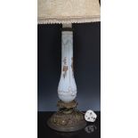 Gilt metal and opaque glass oil lamp, adapted as a table lamp, painted floral decoration,