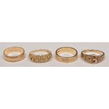 9ct hallmark gold buckle ring, another 9ct hallmark gold ring, two 9ct wedding bands (4).