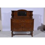 Oak sideboard, bevelled mirror back, base with two drawers over two panel doors, width 122cm.