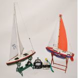 Two R/C model yachts,