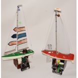 Two R/C model yachts, with stands and radio, one A4 and one A3 type.