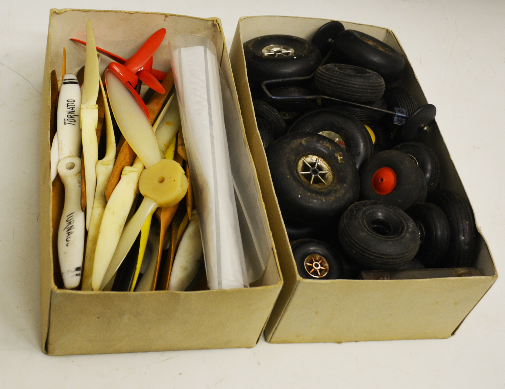 Box containing wheels, props, plains and control line handles etc.