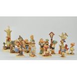 Collection of fourteen Goebel Hummel figures.