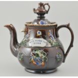 Meerschaum treacle glazed Barge ware teapot, the cover with a kettle finial,