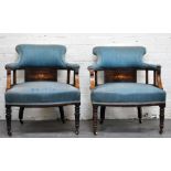 Pair of Edwardian tub chairs, faded blue upholstery, turned and ringed legs.