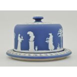 Wedgwood blue Jasperware, cheese stand and cover, decorated with classical maidens, diameter 29cms.