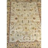 Persian style rug, ivory ground, stylised floral border, 190 x 120cms.