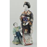 20th Century Japanese figural group, Mother and Child in traditional dress, height 47cms.