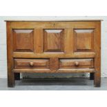 Joined oak mule chest, a three panelled front above two short drawers, width 120cms, height 84cms.