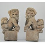 Pair of concrete finials, modelled as Chinese foo dogs, height 45cms.