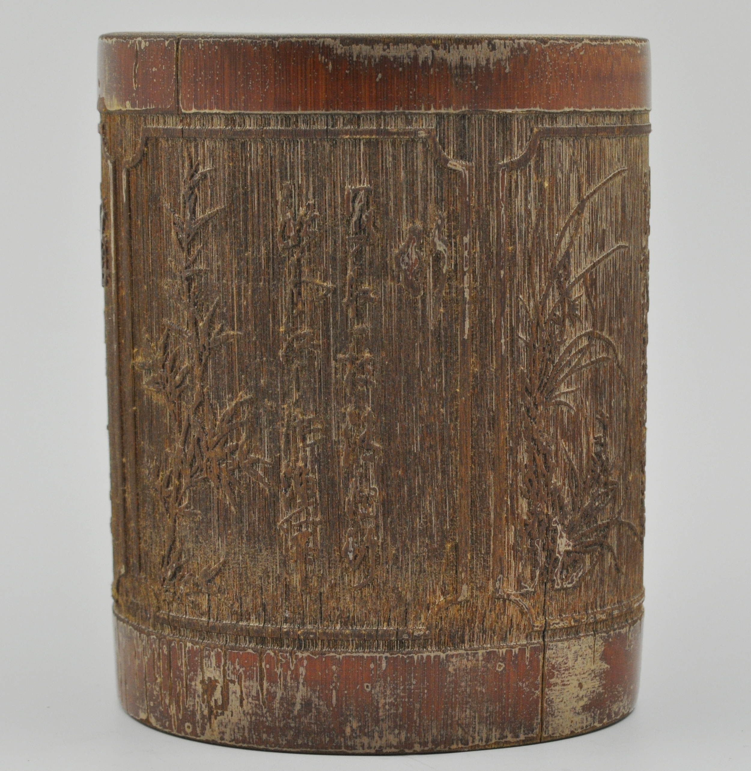 Chinese bamboo brush pot, carved with continuous landscapes, height 15cms.