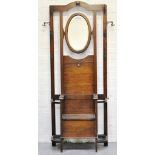 1930's oak hall stand, oval bevelled mirror and box seat.