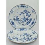 Matched pair of Chinese blue and white chargers, the centre depicting an oriental garden scene, (a.