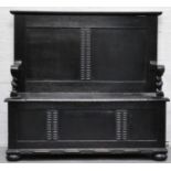 Early 20th Century carved ebonised hall seat, with a box base, bun feet, height 104cms,