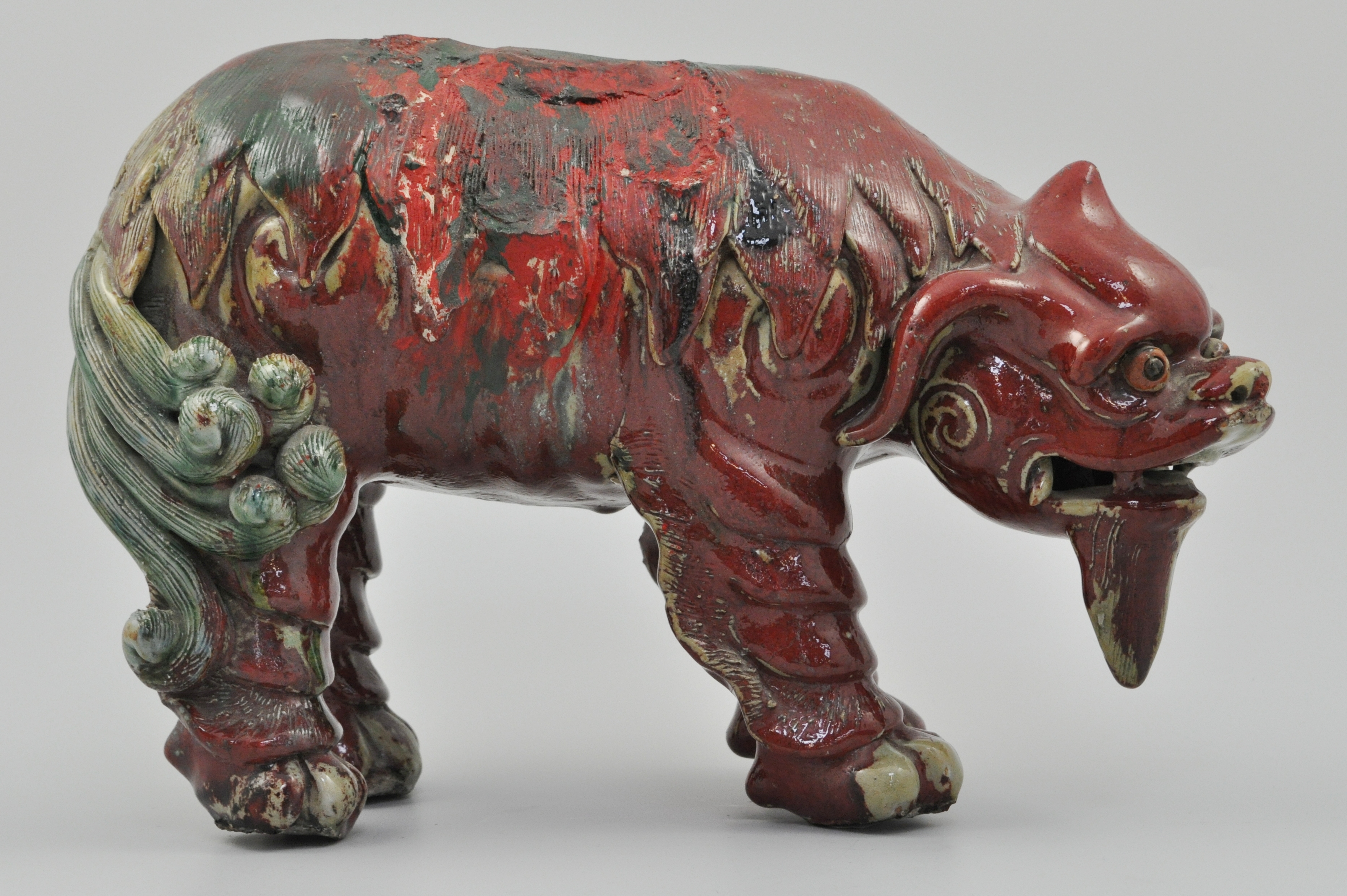 Chinese Kangxi lion dog, (possibly 1662-1722), lacking rider, (restored), height 22cms.