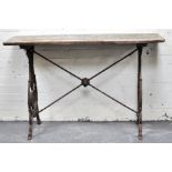 Pair of cast iron pub tables, rectangular wooden tops, height 78cms, width 122cms, depth 47cms.