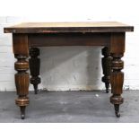 Early 20th Century oak extending draw-leaf dining table, bulbous legs, height 74cms, width 122cms,