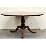 Reproduction oak dining table, circular tilt-top, turned column, tripod base, diameter 152cms.