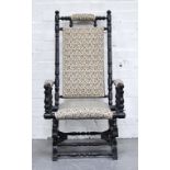 American ebonised rocking chair, with ivory and floral upholstery.