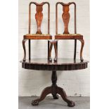 Matched mahogany dining suite, comprising of a circular tripod table, ball and claw feet,