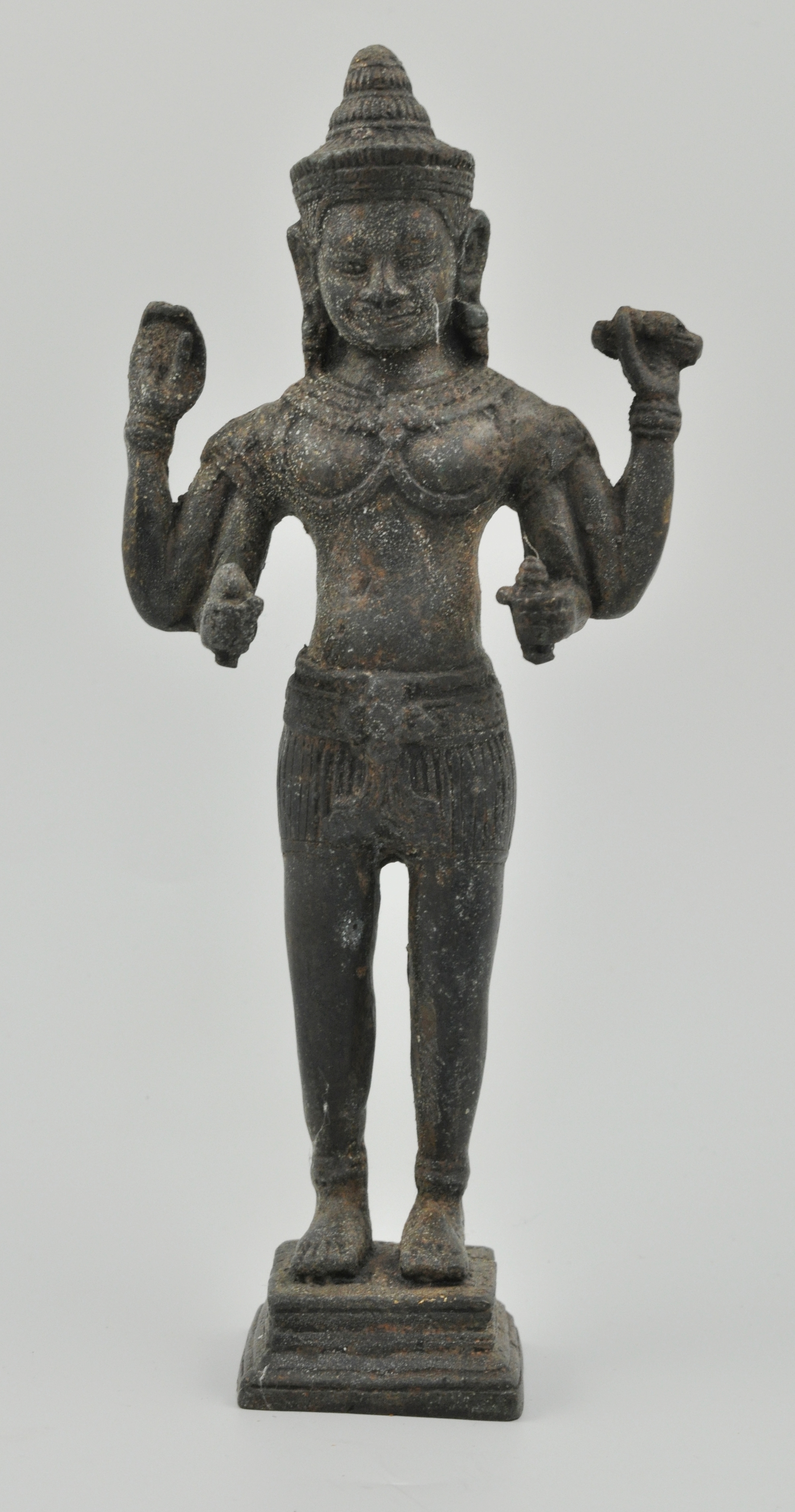 Thai bronze figure of a four armed deity, modelled standing in an ornate headdress,