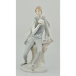 Lladro porcelain figure of Hamlet, seated on a tree stump holding a skull, height 40cms (a.f).