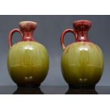 Pair of small Royal Doulton stoneware urn shape vases, decorated with floral pendants, no.